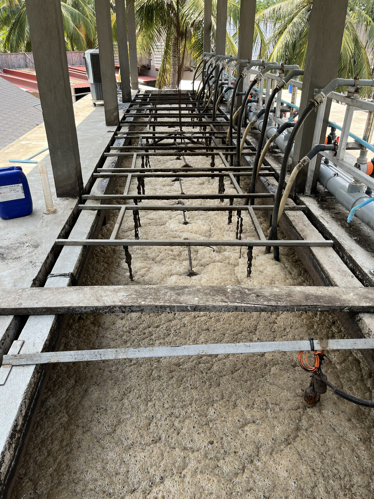 Severe brown foam covering an MBR aeration tank during a field inspection